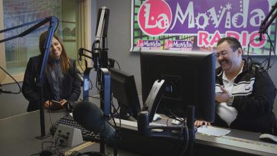 Luis and Lupita Montoto in audio booth at Spanish-language radio station