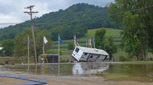 An RV floated into the American Legion's flag poles