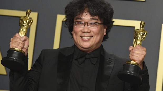 Director of "Parasite" Bong Joon Ho holding Oscar trophies