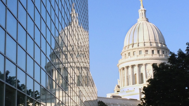The Wisconsin Capitol reflected in an office window