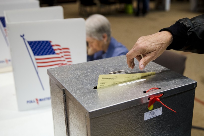  a primary election voter casts a provisional ballot