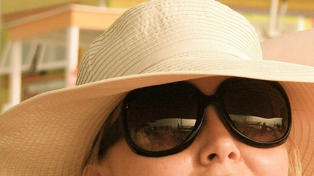 wearing a hat with glasses