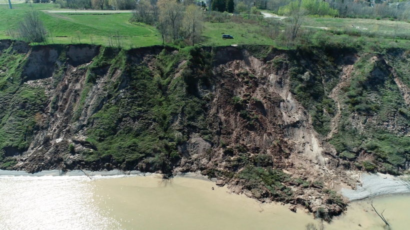 (Drone footage by the research team of a landslide area along Lake Michigan.)