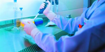 Technician preparing for stem cell treatment. Technician preparing for stem cell treatment.