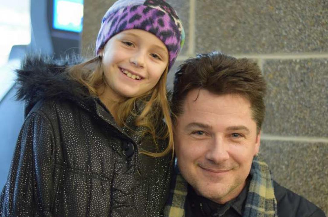 Kirk Stone and his 9-year-old daughter pose together during their interview